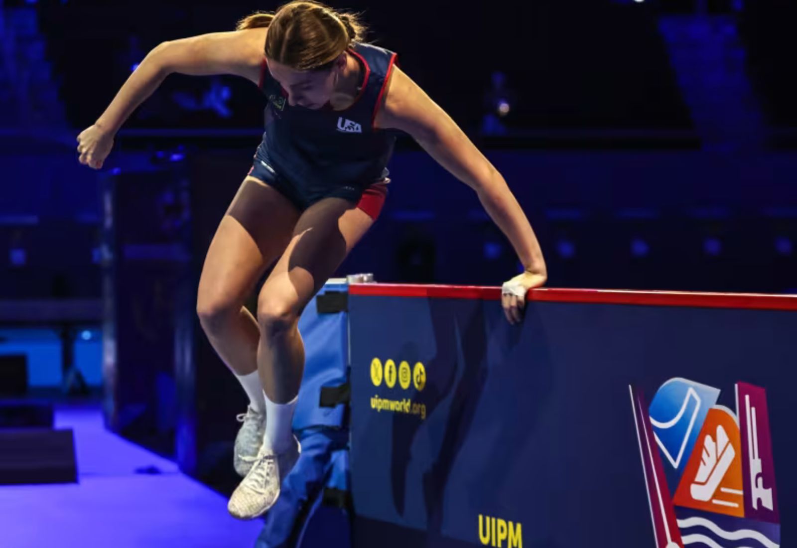 USA Pentathlon athlete Kseniya vaults over a wall during the obstacle course discipline in a Modern Pentathlon competition.
